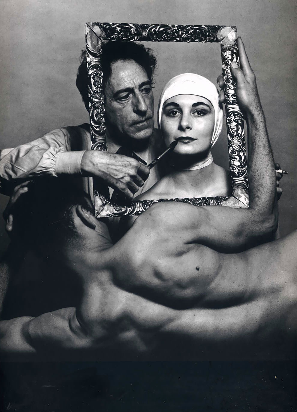 #26 French poet, artist and filmmaker Jean Cocteau with actress Ricki Soma and dancer Leo Coleman. USA, New York City. 1949.