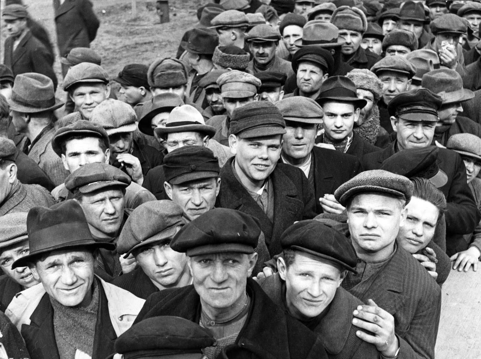 #20 Refugees from across Central Europe queue for food at an Allied Forces refugee camp in Germany, on Mar. 20, 1945.