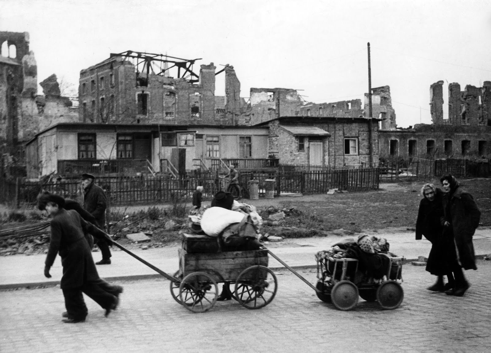 #32 War refugees walking through Berlin with their belongings on Dec. 15, 1945.
