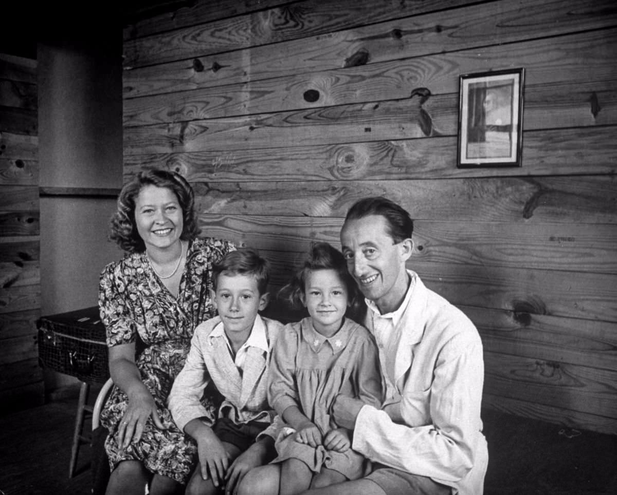 #51 The Albrecht family in their new barracks home. He is Jewish, she is Catholic. Their children are Peter, 10, and Renata, 5. Before war, he operated a theater in Vienna. In 1939 he went to Italy, was followed later by his wife and children.