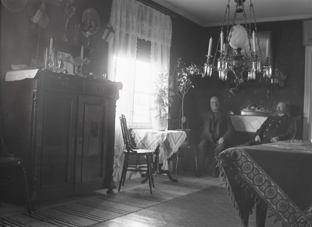 #61 Two men on the sofa.