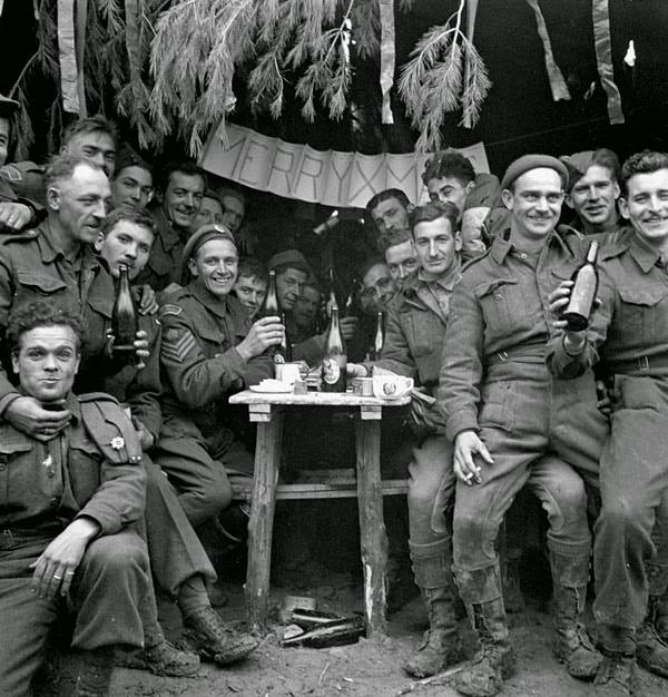 #26 Canadian soldiers enjoying a few drinks on Christmas Day at the front, Ortona, Italy, December 25, 1943.