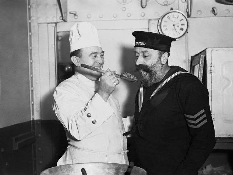 #39 Tasting the Christmas pudding aboard HMS COCHRANE, November 1940.