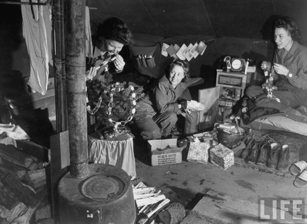 #48 American WACs make paper chains to decorate their tiny tree, Italy, 1944.