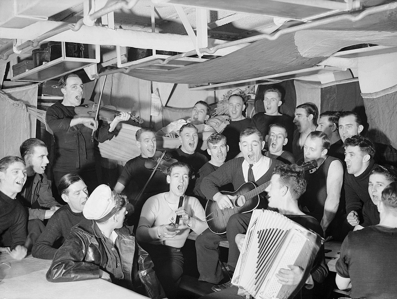 #50 A Christmas singsong on a British warship, 1942.