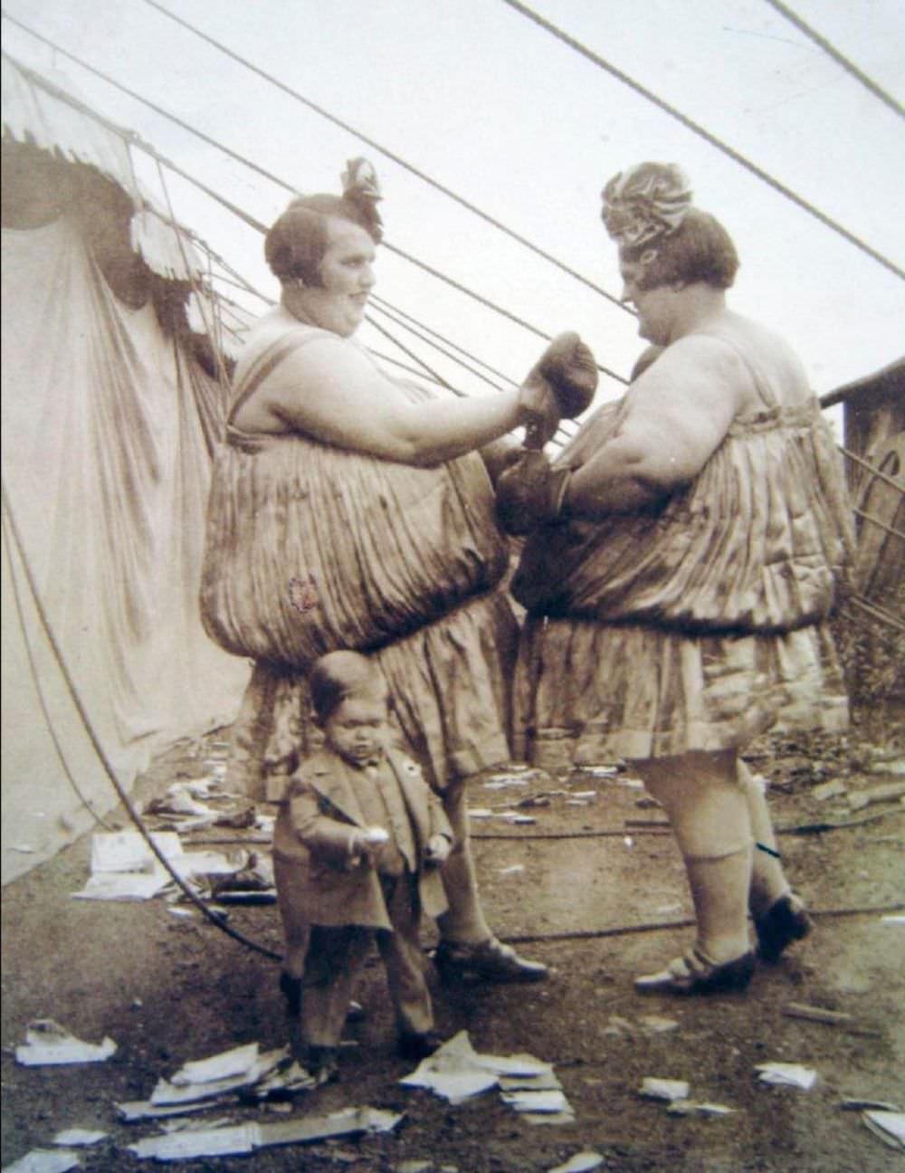 The Carlson Sisters, pictured above, were part of a touring side show circus act, where they would put on a performance as ‘fat twins’ and would box for paying customers, circa 1925, USA.