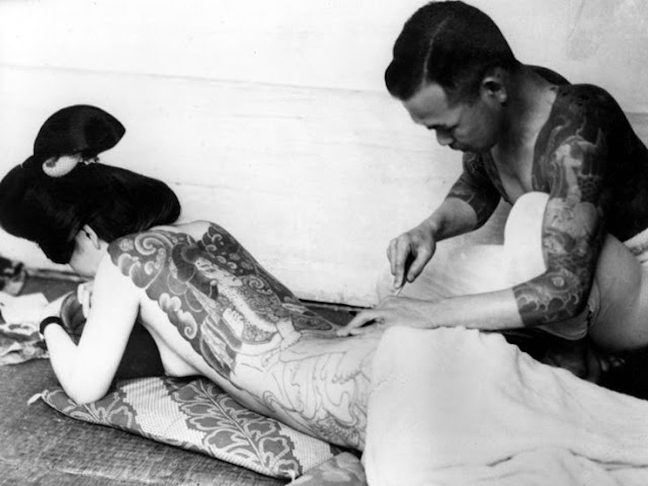#47 Woman being tattooed, ca. 1940s.