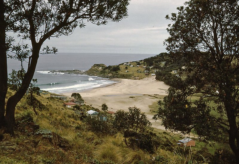 #16 South Era Beach with its many little holiday cottages, is within Royal National Park, south of Sydney, 1953
