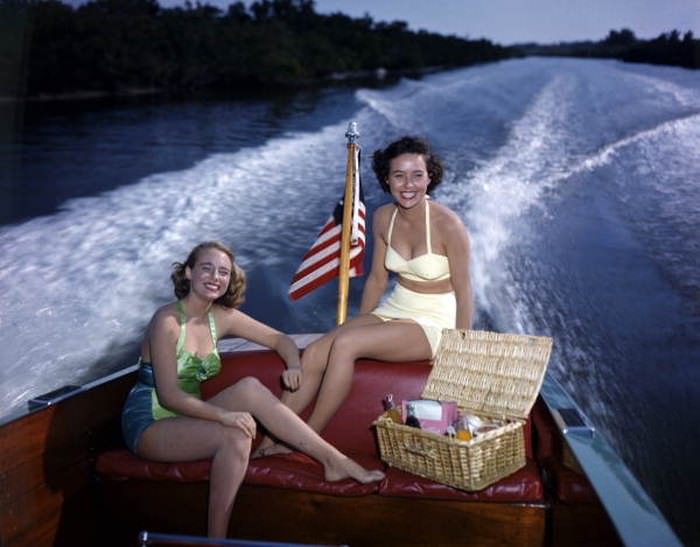#49 Lois Duncan Steinmetz (left) and Polly Gaines in a motorboat: Sarasota, 1950