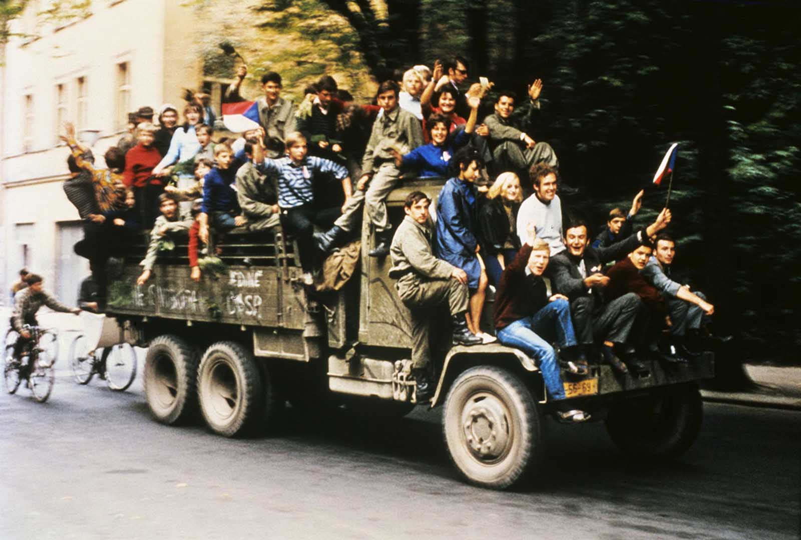 #15 Czechoslovakian army trucks take young people around Prague as Soviet tanks had halted on the outskirts of town and began a siege of Czech army barracks.