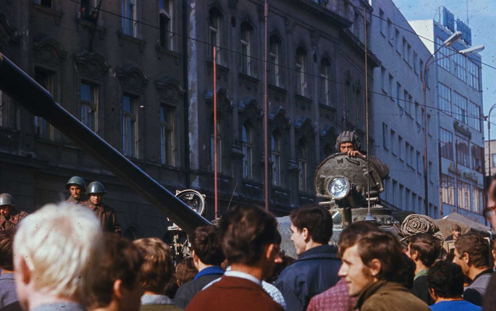 #17 Czechs jeer a Soviet tank in downtown Prague.