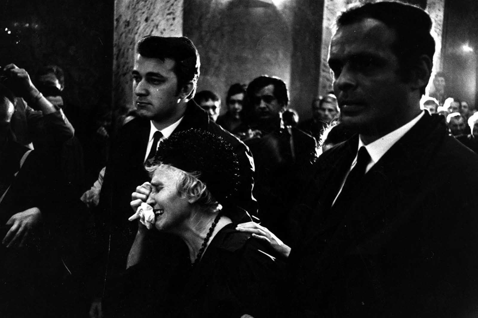 #22 A woman weeps at a funeral for one of the victims of the fighting in Czechoslovakia