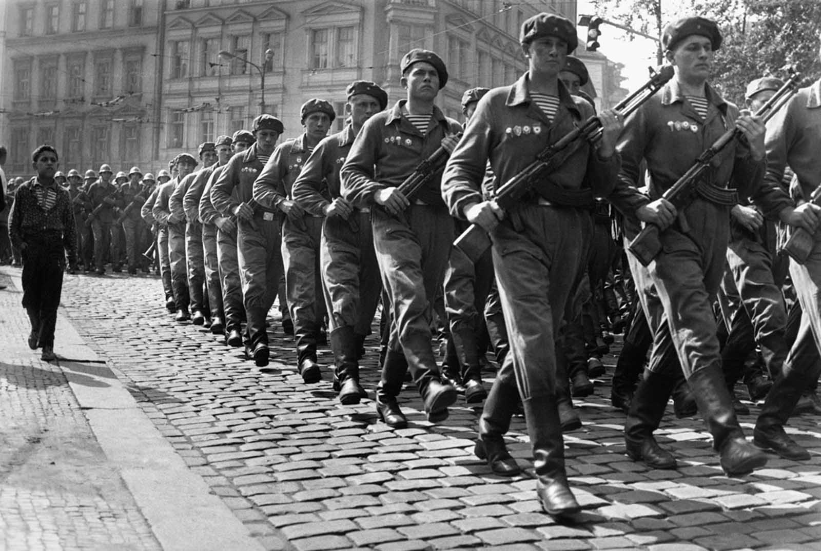 #26 Soviet troops march through Prague in September 1968.