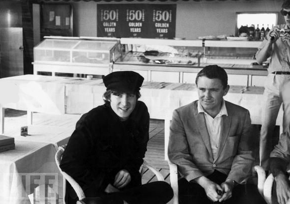 #22 Talk-show host Merv Griffin interviews John Lennon at Cannes for his show in May 1965.
