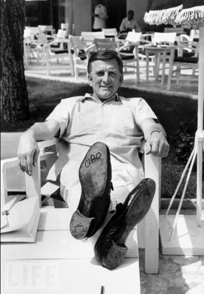 #33 Kirk Douglas lets his feet do the talking on May 9, 1966. The word “ciao” (“hello” or “goodbye” in Italian) is written on the sole of his shoe.