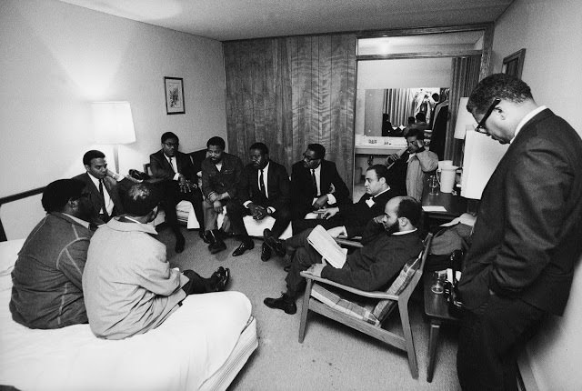 Stunned, silent members of the Southern Christian Leadership Conference in Dr. King’s room at the Lorraine Motel, April 4, 1968.