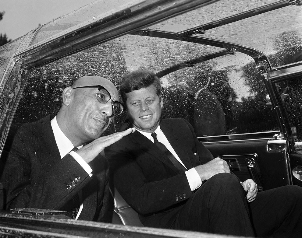 #16 In Washington, D.C., Afghan King Mohammad Zahir Shah talks with US President John F. Kennedy in the car that took them to the White House on September 8, 1963.