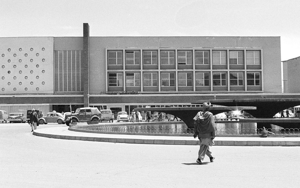 #20 Modern new Finance Ministry building in Kabul, on June 9, 1966, with a public, western-style cafeteria and sidewalk restaurant, facing a water fountain which is illuminated in color at night. (AP Photo)