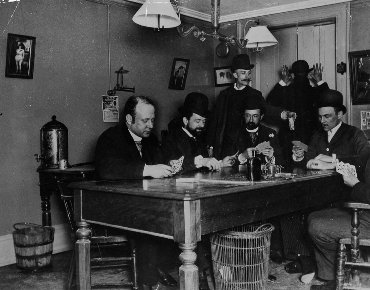 #12 Men play cards in a New York building, 1890