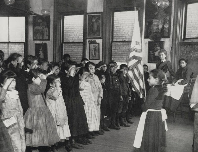 #41 Immigrant children saluting the flag in the Mott Street Industrial School