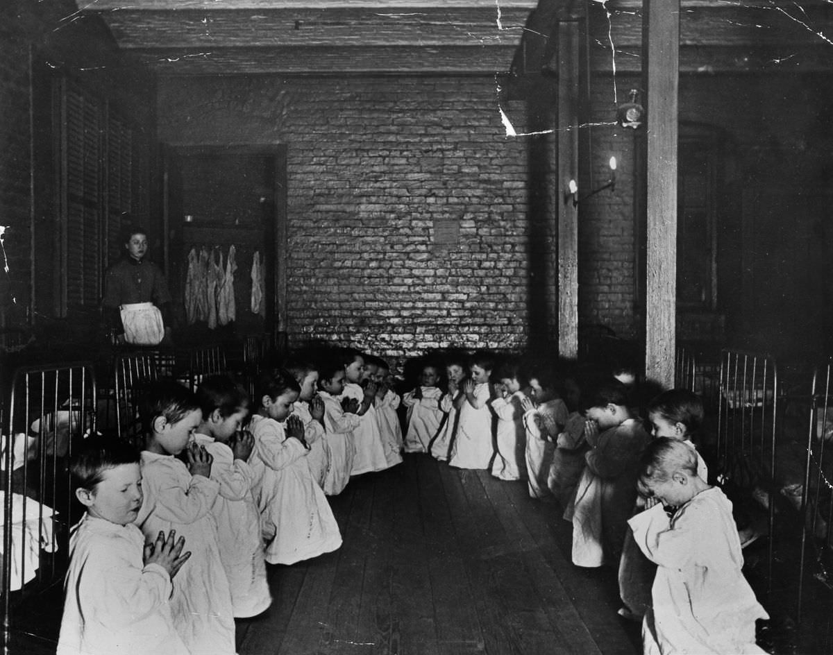 #9 Children pray in the nursery in Five Points House, 1887