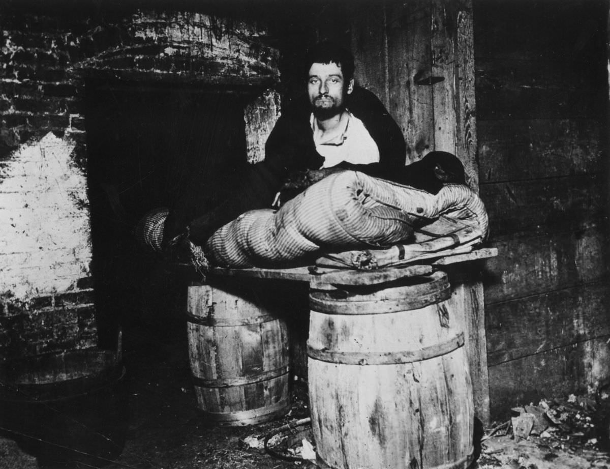 #11 The cellar of 11 Ludlow Street, where beggars sleep in squalid conditions, 1887