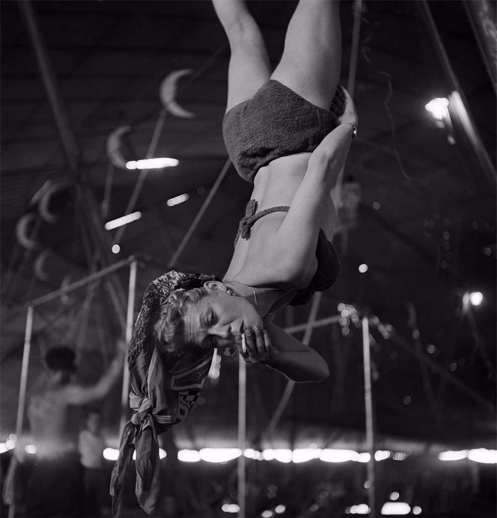 An aerialist smoking while rehearsing for the Ringling Bros. and Barnum &; Bailey Circus in Sarasota, FL in 1949.
