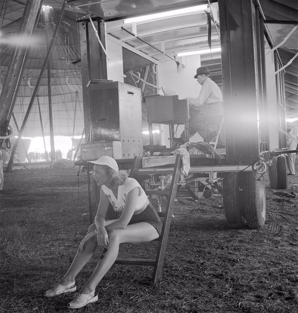 A circus girl sitting on a ladder during a rehearsal for the Ringling Bros. and Barnum &; Bailey Circus in Sarasota, FL in 1949.