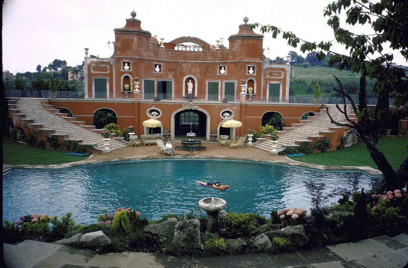 #27 Sophia Loren swimming in the pool at her villa.