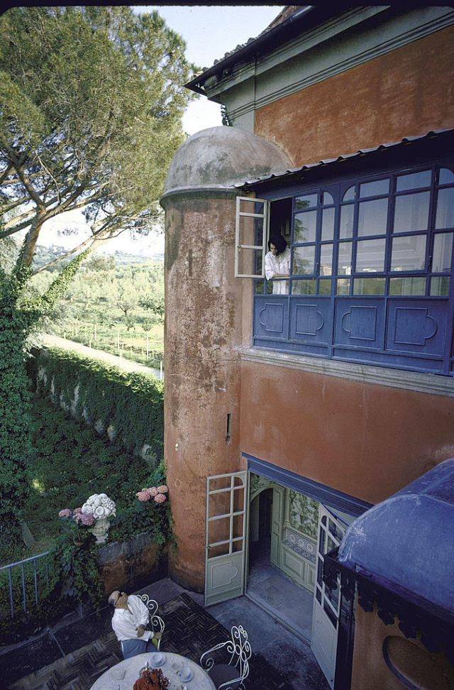 #3 Carlo Ponti on the terrace while Sophia Loren talks to him from above.