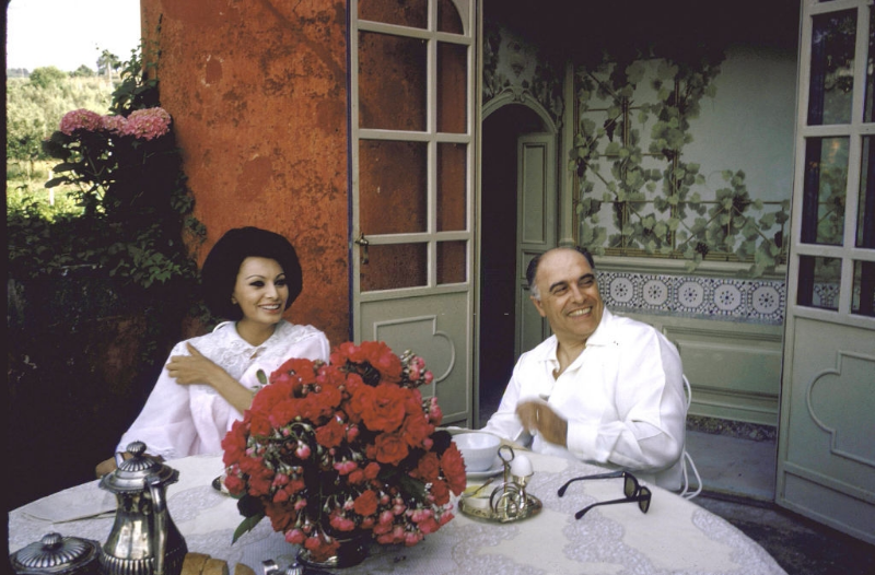 #13 Sophia Loren and Carlo Ponti sitting on the terrace during breakfast.