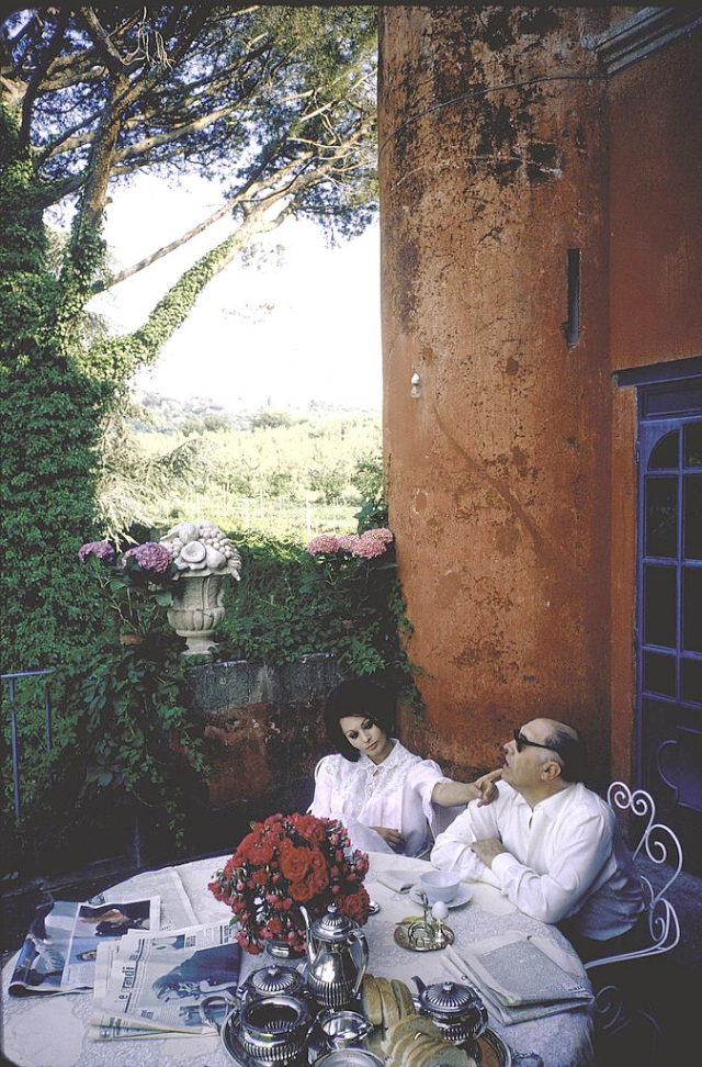 #21 Sophia Loren and Carlo Ponti out on the terrace of their villa having breakfast.