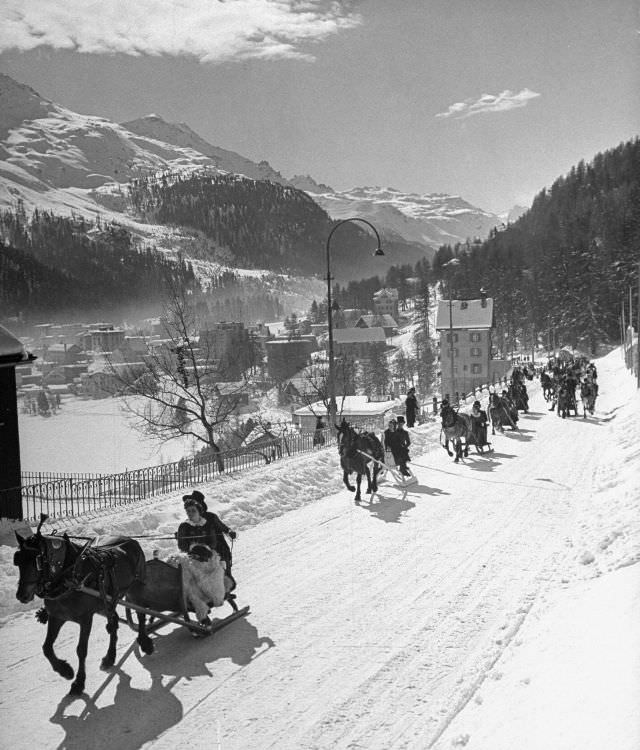 #2 Sleigh-ride from town to jumping hill in snow-covered ski-resort village.