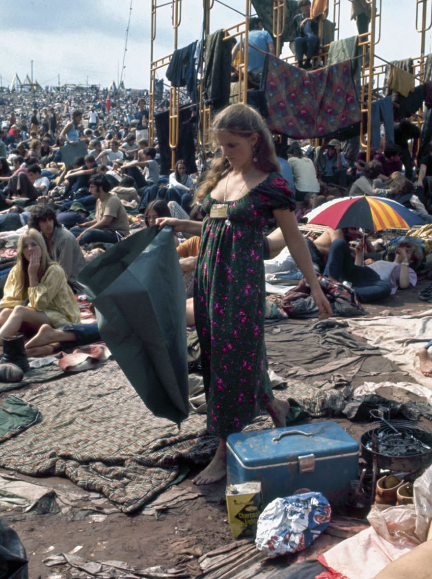 #33 Woman Picks Her Way Barefoot Through Mud And Sleeping Bags