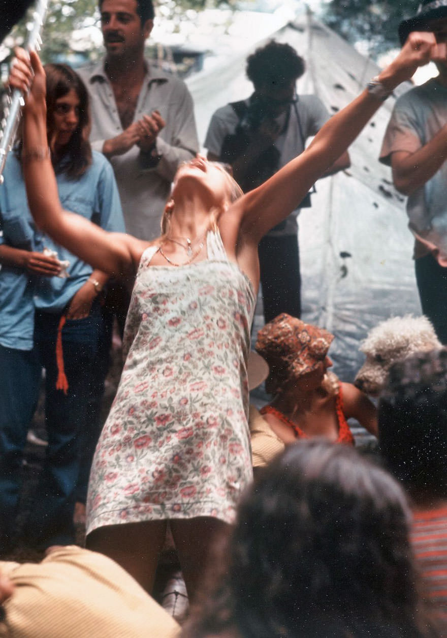 #35 Hippie Girl Enthusiastically Playing Flute And Dancing At Woodstock Music Festival