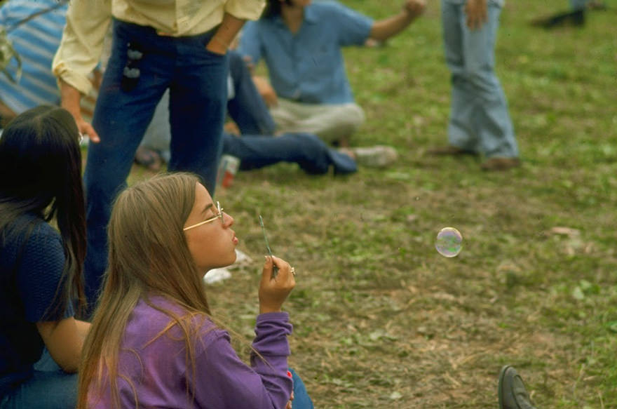 #43 Jackie Barg Siting On The Ground & Blowing Bubbles, During The Woodstock Music & Art Fair