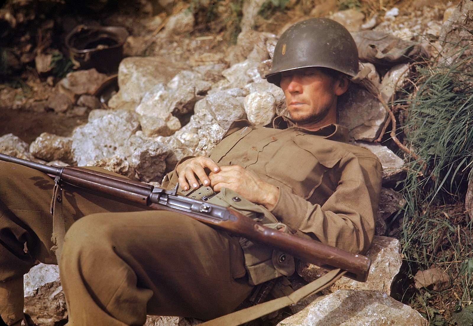 #35 A soldier sleeping in the sun.