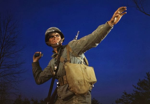 #143 An American pineapple, of the kind the Axis finds hard to digest, is ready to leave the hand of an infantryman in training at Fort Belvoir, Virginia