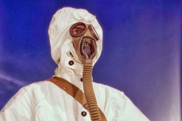 #145 A sailor at the Naval Air Base wears the new type protective clothing and gas mask designed for use in chemical warfare, in Corpus Christi, Texas, in August of 1942