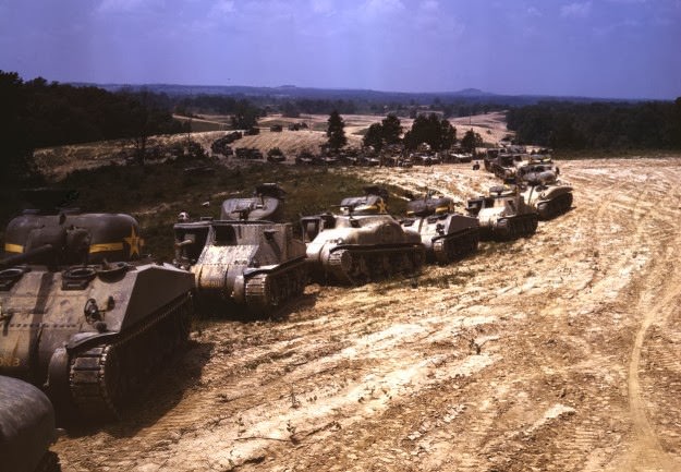 #150 A parade of M-4 (General Sherman) and M-3 (General Grant) tanks in training maneuvers, at Ft. Knox, Kentucky. Note the lower design of the M-4, the larger gun in the turret and the two hatches in front of the turret. Photographed in June of 1942