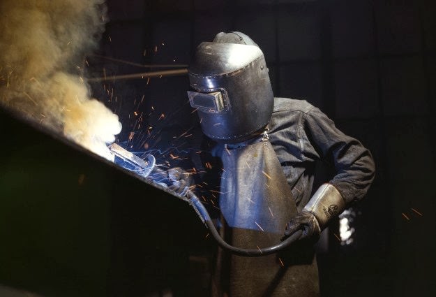 #166 A welder making boilers for a ship, at Combustion Engineering Co., Chattanooga, Tennessee, in June of 1942