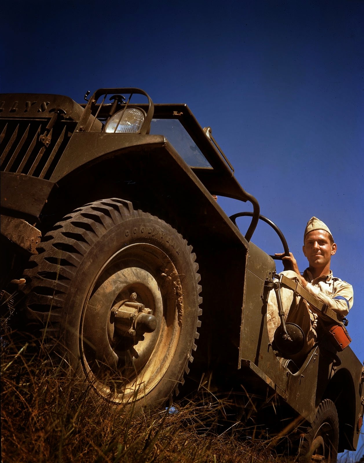 #15 An American soldier sits behind the wheel of a Willys MB jeep, shortly before the United States joined World War II, 1941.