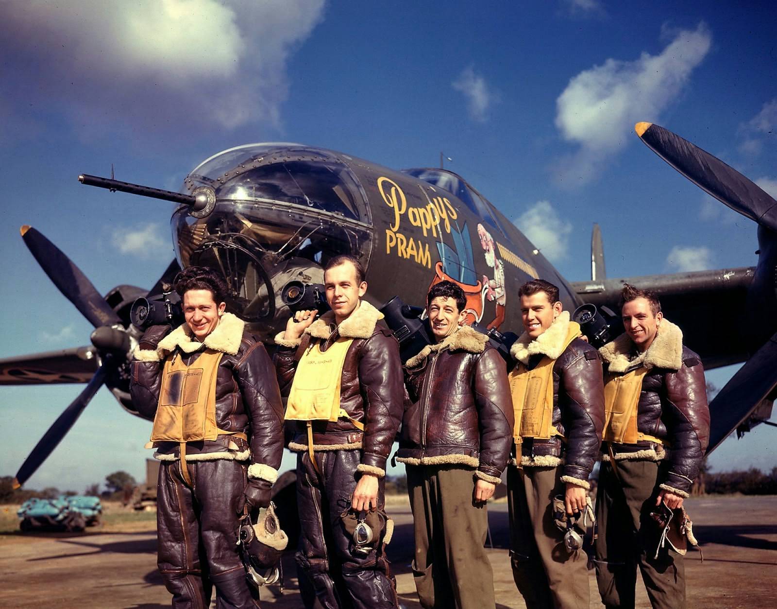 #18 Photographers standing in front of Pappy’s Pram, a B-26 Marauder at base, 1943.
