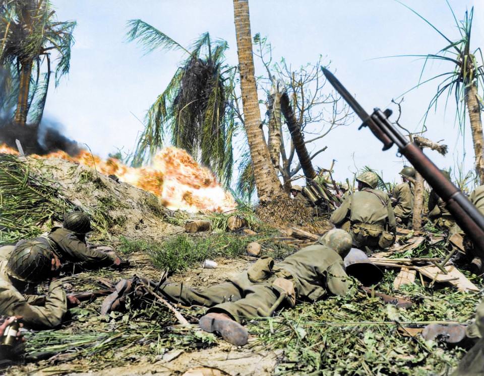 #43 US soldiers of the 7th Infantry Division attacking a Japanese blockhouse on Kwajalein in the Marshall Islands in 1944. The troops began capturing the islands by landing their forces on the beaches.