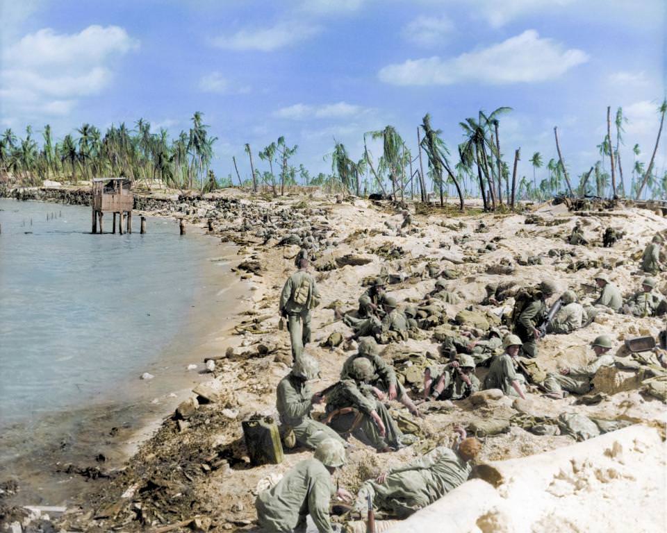 #47 US marines huddled on the beaches during the Battle of Tarawa in World War Two, Kiribati, 1943.