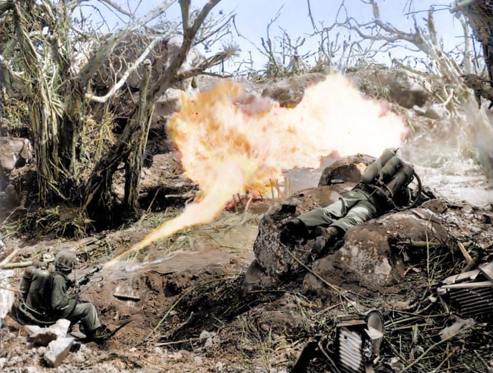 #23 Marines torch a Japanese defensive in Iwo Jima’s Mount Suribachi by using flamethrowers in 1945. These military tools were an effective weapon for burning out entrenched fighters who would have otherwise continued to fight, costing more lives. Pictured are Pvt. Richard Klatt and PFC Wilfred Voegeli