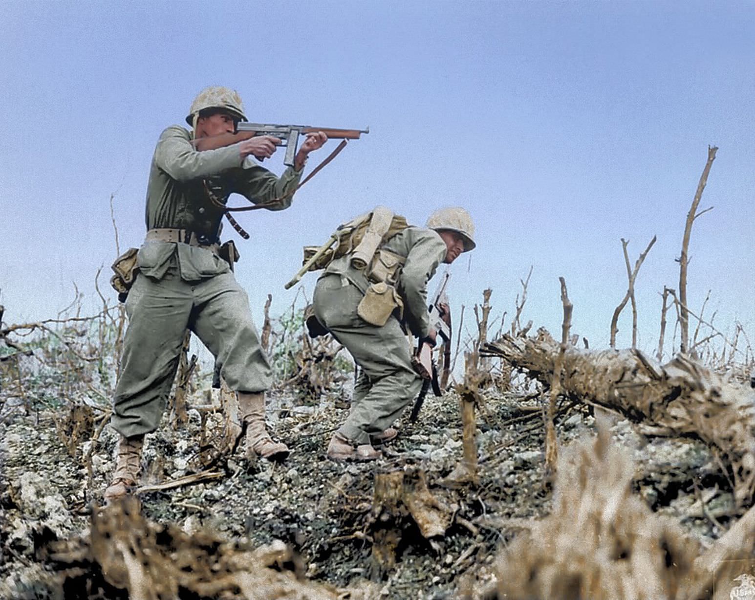 #58 Two Marines from the 2nd Battalion, 1st Marine Regiment during fighting at Wana Ridge during the Battle of Okinawa, May 1945.