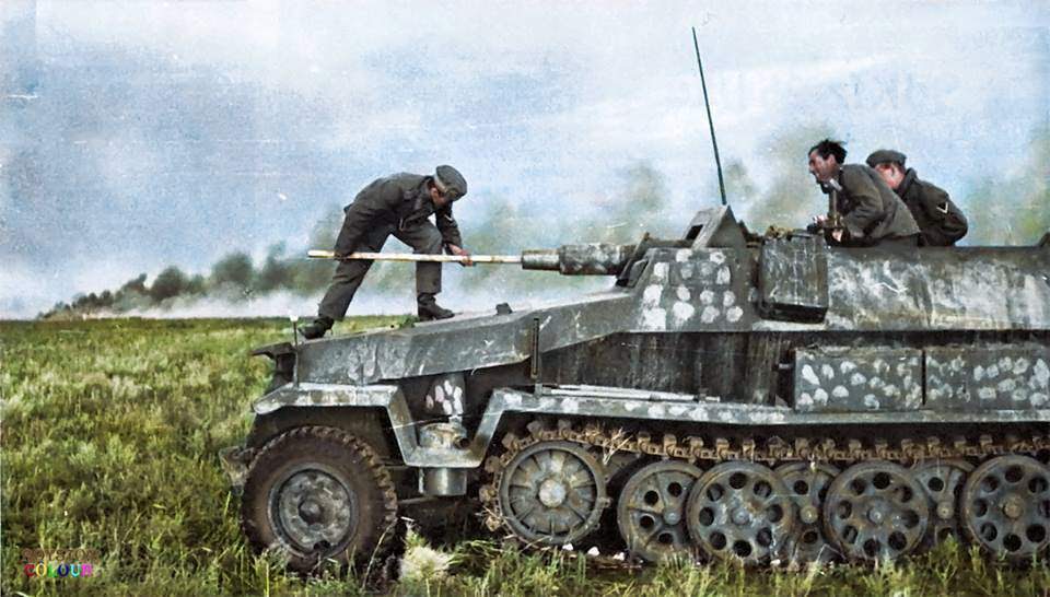#68 A crew member cleaning the barrel of an Sd.Kfz. 251/9 – Schützenpanzerwagen (7.5 cm KwK 37 L/24) “Stummel” on the East Front, c. Summer 1942.