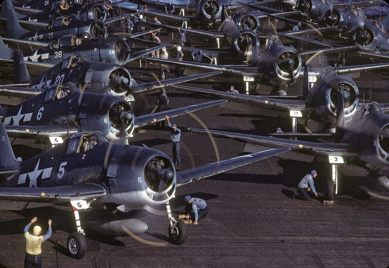 #8 The flight deck crew prepares planes for launch from the USS Lexington (CV-16), en route near New Guinea, early April, 1944.
