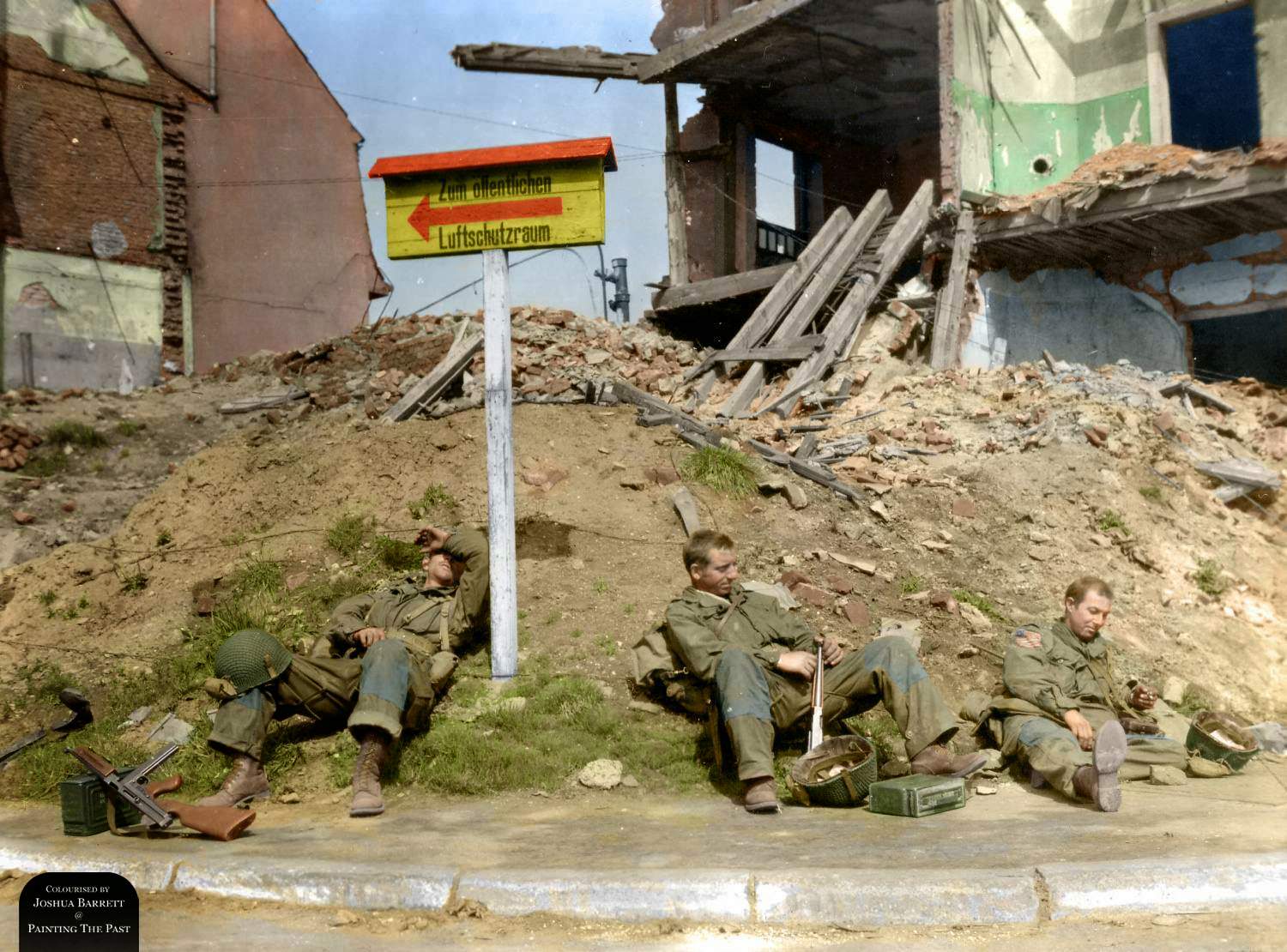 #84 Three troopers of the 507th Parachute Infantry Regiment, 17th Airborne Division taking a break after 5 days frontline fighting. From left to right : Pvt William H. Sandy (ASN 13032007) from Charlottesville, VA, Sgt Dehaven Nowlin (ASN 15046241) from Goshen, KY and Pvt Howard Fredericks (ASN 39241668